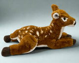 Side view of 22-inch weighted deer plush showing spotted back and relaxed legs.