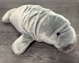 32-inch weighted manatee plush, light gray, full-body side view on neutral surface