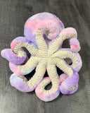 Underside of weighted octopus displaying ribbed beige tentacles and plush body