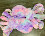 Two soft plush purple pink blue weighted octopuses side by side to show fabric variation