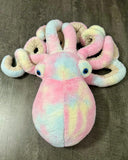 Top view of cotton-candy weighted octopus plush highlighting pastel pink, blue, yellow color placement.
