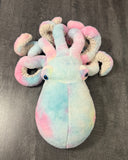 Front view of pastel cotton-candy blue, pink and yellow weighted octopus plush with tentacles curled around the head.