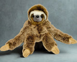 Front view of weighted sloth plush sitting with long arms out to the sidea; ultra-soft brown and cream fur, 21-inch calming stuffed animal.