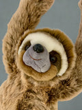 Face close-up of weighted sloth lying with arms up; soft mask markings and plush muzzle; ultra-soft fur.