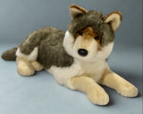 Jumbo premium 37" weighted wolf plush in three-quarter view floppy laying pose with head slightly cocked for realistic look.