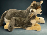 Two premium weighted wolves; large 26" and jumbo 37", laying side by side for size comparison, with plush realistic fur and lifelike poses.