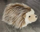 Side view of 14-inch weighted hedgehog plush showing fluffy faux-quill coat.