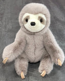 Front sitting view of 16-inch “Super Soft” weighted sloth plush; velvety light-gray fur, cream face mask, gentle eyes and smile; calming stuffed animal up to 4 lb.