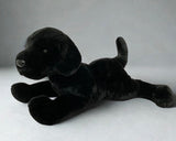 23-inch weighted Black Lab plush lying in a relaxed pose; ultra-soft black fur, floppy legs and tail; calming stuffed dog up to 9 lbs.