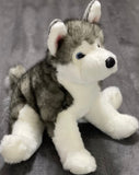 Front/three-quarter sitting view of weighted Husky plush; ultra-soft grey/white fur, blue eyes, chunky legs for cuddling.