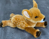 Weighted fawn plush lying on its belly, 15-inch baby-soft deer with realistic spots.