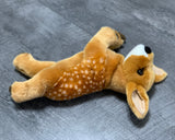 Realistic weighted fawn plush laying floppy on its side and back, legs open, and head pointing up, with white muzzle and realistic spots on its back.
