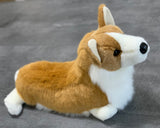 Side profile of weighted Corgi plush, tan and white coat with big ears; 20-inch calming stuffed dog. on gray surface.