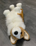 Corgi plush lying on its back with paws up; fluffy white chest and tan body; weighted 20-inch stuffed animal.