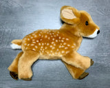 Side profile of ultra-soft fawn plush showing realistic ears, muzzle, and spotted coat.”