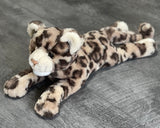 Top/side view showing the length and tail of the 20-inch leopard plush; relaxed, low-profile body.