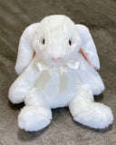 Silky white weighted  rabbit plush sitting, front view, floppy ears and cream satin bow.