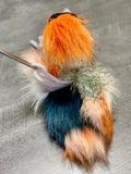 Back view of crowned crane plush showing multicolor faux-feather plumage and tail.