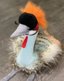 Weighted crowned crane plush with bright orange crest, long lashes, and fluffy faux-feather body, front view sitting.