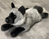 Three-quarter view of weighted realistic gray fox plush with dark muzzle and soft fur for sensory input.
