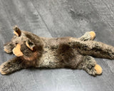 Top view of 20-inch weighted Maine Coon plush cat lying stretched out, brown-and-cream faux fur, relaxed paws.