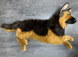 Full-length German Shepherd weighted plush stretched out on floor, laying pose with extended front legs, lifelike 40", up to 24lbs deep pressure companion.