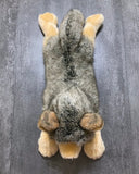 Overhead view of 26-inch weighted wolf plush showing thick grey back and cream paws.