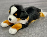 Weighted Bernese Mountain Dog plush lying down; tri-color black, rust, and white fur with lifelike jowls; 19-inch calming stuffed dog.