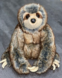 Front sitting view of large weighted sloth plush in brown, gray, and beige with soft belly and friendly face; ultra-soft fur for soothing hugs.