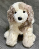 Sitting Great Pyrenees plush puppy with fluffy ears and black nose, weighted for calming comfort