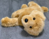 Golden Retriever weighted plush lying on its side; thick golden coat, black nose; 19-inch calming stuffed dog for cuddling.