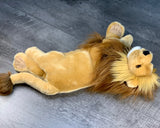 Lion plush lying on back with paws up; fluffy mane and soft body for squishy cuddles.