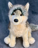 Seated front view portrait of 18-inch weighted gray wolf plush with perky ears, soft cream undercoat, lifelike eyes and realistic fur.