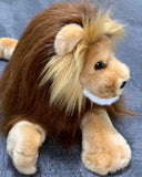 Close-up side view of weighted lion plush head with full brown and gold mane, soft tan coat, and chunky paws; 22-inch calming stuffed animal.