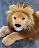 Front close-up of lion plush showing realistic mane, muzzle, and paws; ultra-soft weighted stuffed lion.