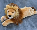 Full-body view of 22-inch weighted lion lying down; long body and thick mane for cozy hugs.