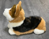 Tri-color corgi plush side view showing compact loaf body and short legs.
