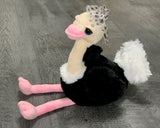 Weighted 11-inch sitting ostrich plush with long pink legs and and beak, black-and-white body and bow, 2 lbs.