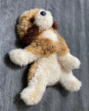 Goldendoodle plush shown flat to display full body and fluffy paws.