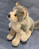 Seated angle of weighted wolf plush highlighting thick faux-fur ruff and perky ears.