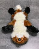 Underside of weighted red fox plush displaying soft white belly and floppy limbs.