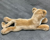 Top/back view of mountain lion plush showing full length and soft tawny fur in a laying pose.