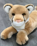 Close front view of weighted mountain lion (cougar) plush with tawny coat and pink nose; ultra-soft 20-inch calming stuffed animal.