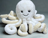 White plush octopus toy with a smiley face on a gray background