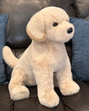 Side profile of weighted lab dog plush showing relaxed sitting position