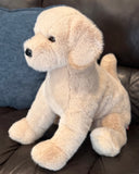 Weighted lab dog plush sitting on couch, soft beige plush dog up to 11lbs.