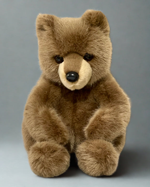 Weighted brown bear plush sitting upright with realistic fur, 19 inches tall, designed for lap hugs.