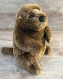 Side view of weighted beaver plush with realistic standing design and soft brown fur.