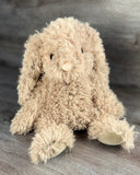 Front view of weighted curly bunny plush showing soft curly fur and floppy rabbit ears.