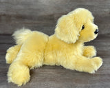 Side laying view of a 5 lb weighted Golden Retriever puppy plush with premium thick faux fur and full-body weighted design.